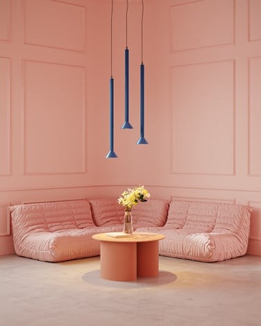 Blue suspended lighting in a modern pink living room environment