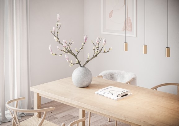 Round pendant lighting above dining table